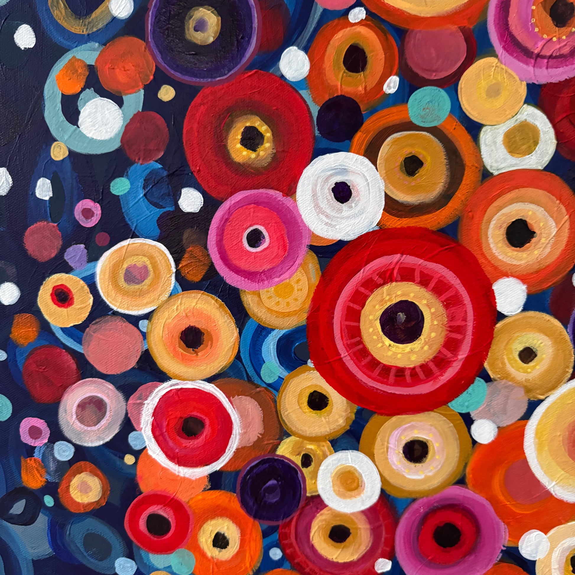 Close-Up: Colorful abstract pattern of circular shapes on a dark blue background