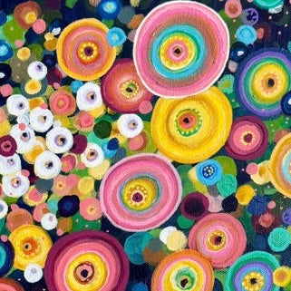 Colorful pattern of circular shapes and flowers on a dark background